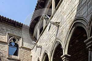 Stone walls of Picasso Museum under blue sky in Barcelona, Spain