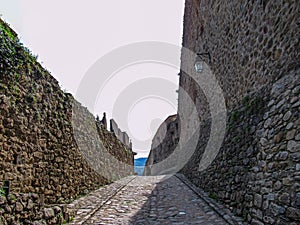 Stone walls and road around medieval town Prats-de-Mollo-la-Preste, Pyrenees-Orientales, Occitanie, southern France