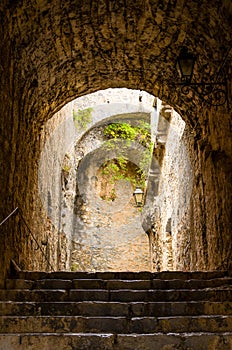 Stone walls, stairs and lamp indoor of ancient Castello Doria castle tower in Portovenere