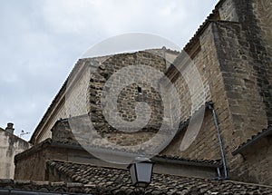 Stone walls and tiled roofs of the Church of San Isidoro photo