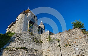 Stone walls and towers of a medieval castle in the town of Provins