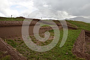 Stone walls uncovered by archaeologists at the Puma Punku, a UNESCO world heritage site. Tiwanaku, Bolivia