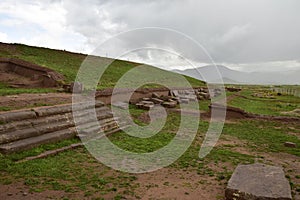 Stone walls uncovered by archaeologists at the Puma Punku, a UNESCO world heritage site. Tiwanaku, Bolivia