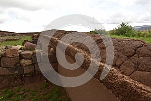 Stone walls uncovered by archaeologists at the Puma Punku, a UNESCO world heritage site. Tiwanaku, Bolivia