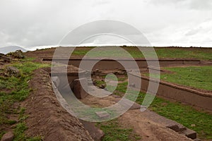 Stone walls uncovered by archaeologists at the Puma Punku, a UNESCO world heritage site. Tiwanaku, Bolivia