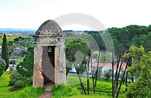 The stone watchtower and the green landscape of Alentejo photo