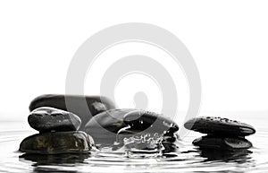 Stone in water with drops