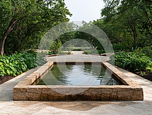 Stone water feature in a tranquil garden setting