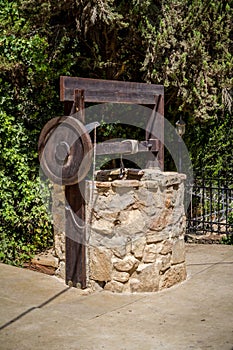 Stone water well with winch near the entrance to the archaeological park of Shiloh, Israel