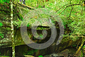 The big stone was borned near the waterfall. photo