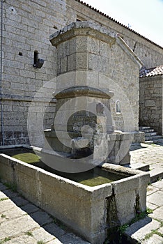 A stone waterhole near the church in Arbellara. Corsica. France