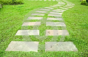 stone way in green grass
