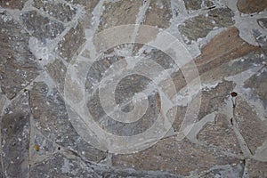 A stone way or path in or through a garden made of beautiful stone tiles. texture or background look. Architecture