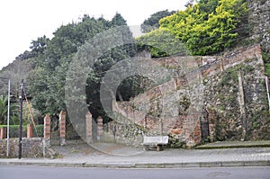 Stone Way to Mansion with Puerta de los Payaros or gate of Birds in Downtown of Comillas Resort in Spain