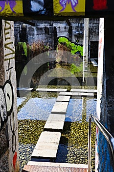 Stone Way through Water in an abandoned Industry Place