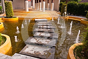 Stone way on water with fountain