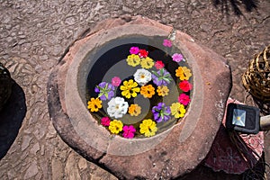 Stone well with colorful flower