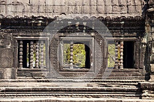 Stone windows with pillars. Angkor, Cambodia