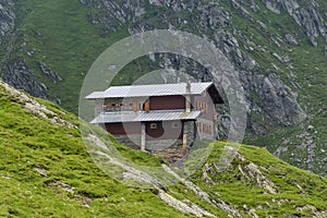 Stone and wood chalet on the mountain range