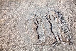 Stone with yoga people in Hampi