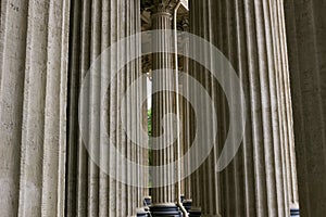 Stoned facade architectural window arches and columns. Medieval castle church exterior. Minimal architecture design and detail