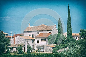 Stoned houses and cypress trees, Bale, Croatia