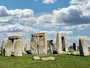 Stonehenge in Bright Day with Dramatic Clouds Behind It