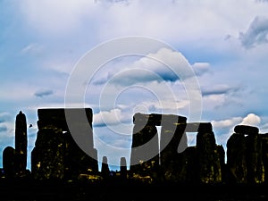 Stonehenge in silhouette under dramatic sky