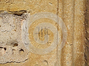 Stonemason mark carved on the facade of Nuestra SeÃ±ora de la ConcepciÃ³n church. Yelo, Soria, Spain photo