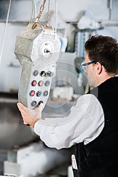 Stonemason operating stone saw