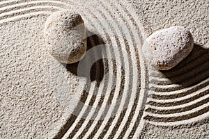 Stones across sand lines for concept of direction and change