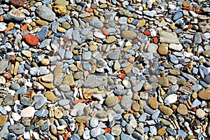 Stones background in gray, brown, orange and yellow hues