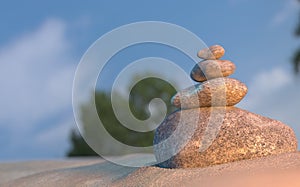 Stones balance on beach, sunrise 3d illustration