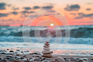 Stones balance on beach, sunrise shot. Nature background for relaxation and meditation