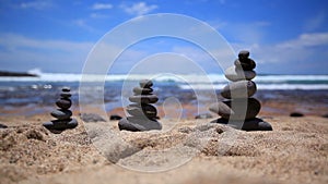 Stones balance on vintage beach, inspirational summer. Picturesque sea landscape. Tenerife. Ocean. Sea waves. Beach.