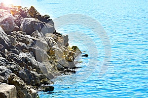 Stones on the beach and beautiful blue sea. The Island Of Crete