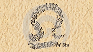 Stones on beach sand handmade symbol shape, golden sandy background, libra zodiac sign