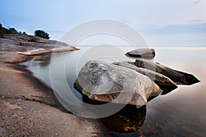 Stones in calm sea photo