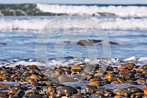 Stones Covering South Carlsbad State Beach with Crashing Waves