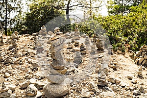 Stones in equilibrium. pile of rocks in the woods. stack of stones in the park.a stone tower.Trekking touristic.Balance