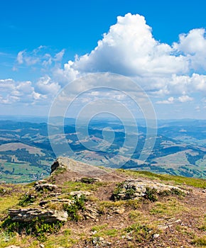 Stones on a hillside with beautiful sky.