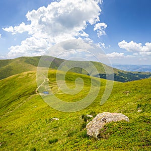 Stones on the hillside with lake