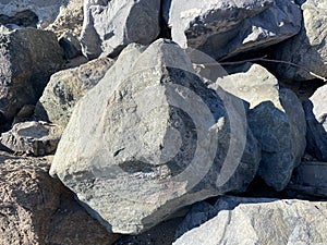 Stones, natural granite, are on the seashore