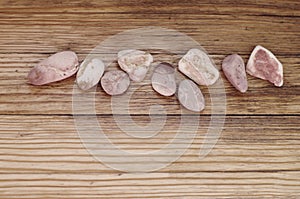 Stones on old wooden background