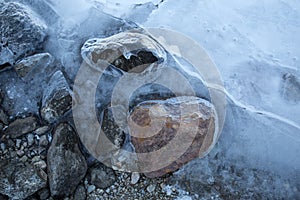 Stones partially covered in ice