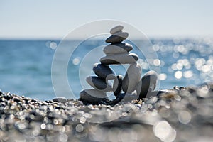 Stones and pebbles stack, harmony and balance, One big pyramid stone cairn on seacoast