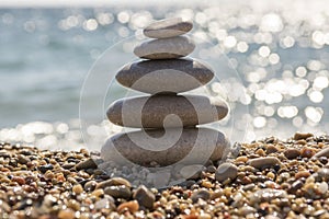Stones and pebbles stack, harmony and balance, one stone cairn on seacoast