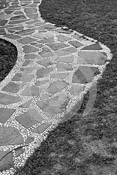 Stones and pebbles walkway in black and white