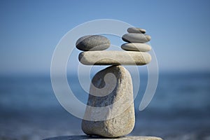 Stones pile background. Scales balance. Balanced stones on the top of boulder. Decide problem. To weight pros and cons.