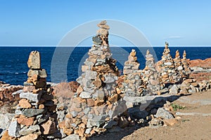 Stones Piled on Each Other near Coastline: Rocks and Cliffs near Sea